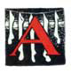 A decorative red letter A on black, bordered by a white pine-bough pattern.