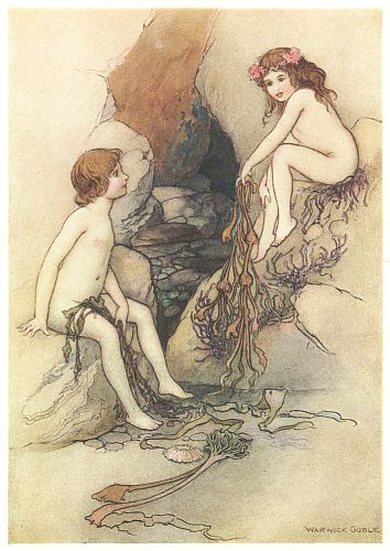 Two children sit on rocks in a sea cave, one holding trailing seaweed.